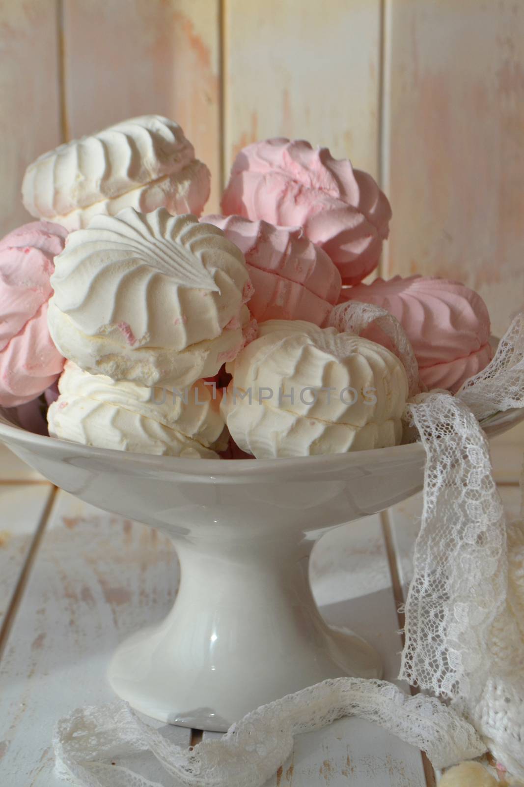 Russian dessert with agar soft sweet light and airy marshmallow meringue, white and pink zefir, vertical image