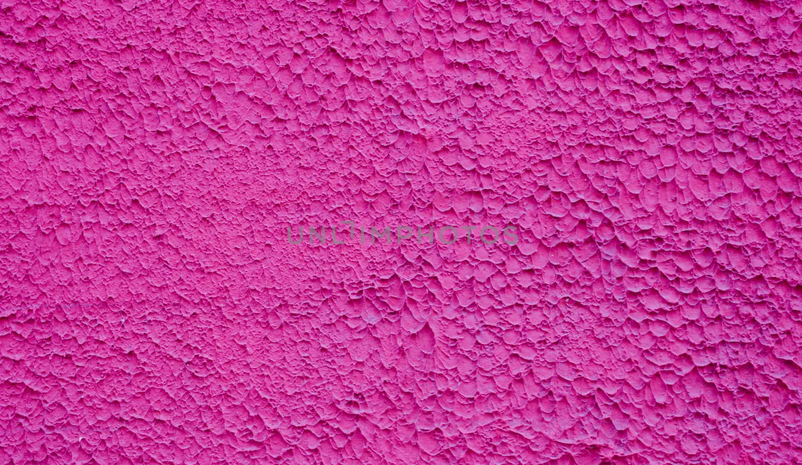 Rough decorative relief . Maroon decorative plastered wall. Maroon wall background.