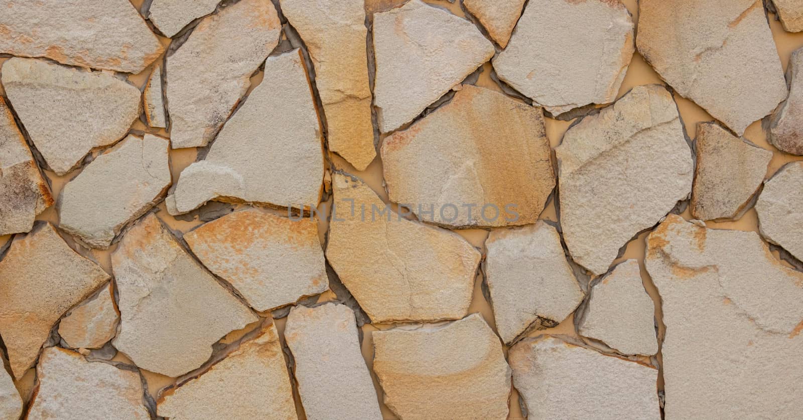 Natural stone walls. Beige textured wall background for interior design.