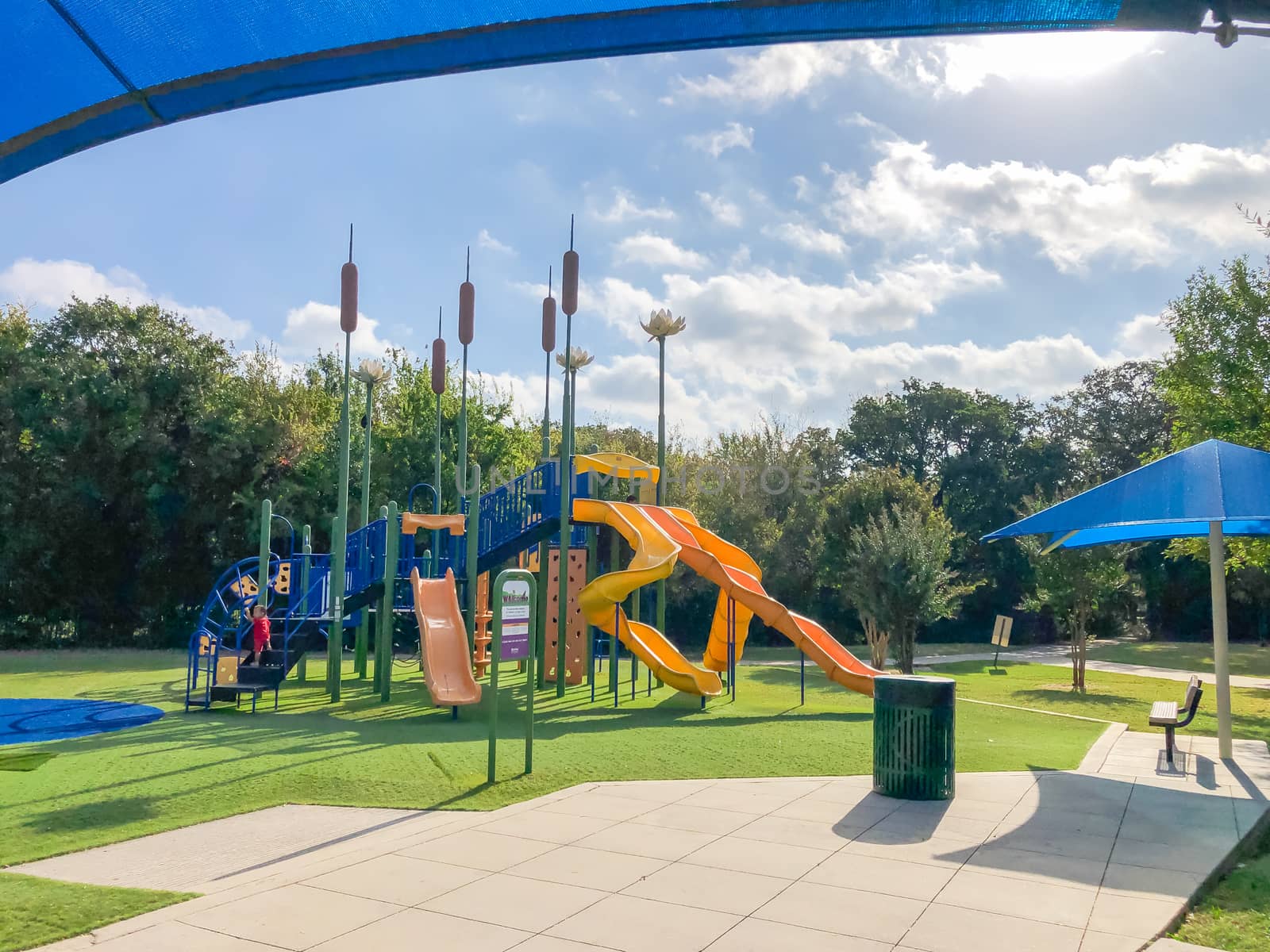New playground with sun shade sails, artificial grass in Flower Mound, Texas, America by trongnguyen