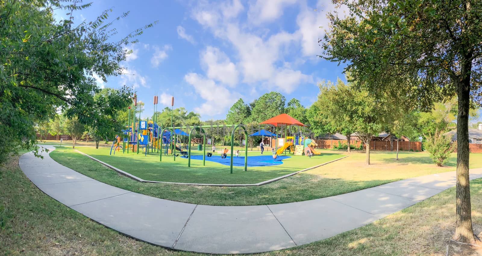Panoramic view neighborhood playground with sun shade sails, artificial grass in Flower Mound, Texas, America by trongnguyen