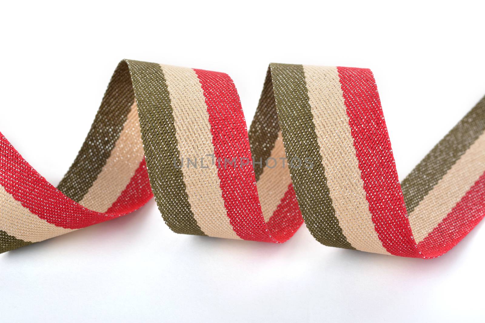 Red khaki green beige Cotton ribbon, strapping tape with curl on white backgroud. Use for sewing clothes, bags. Space for text.