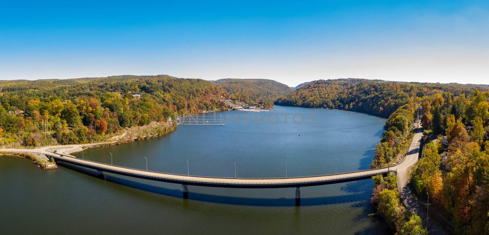 Aerial panorama of fall colors on Cheat Lake Morgantown, WV with bridge by steheap