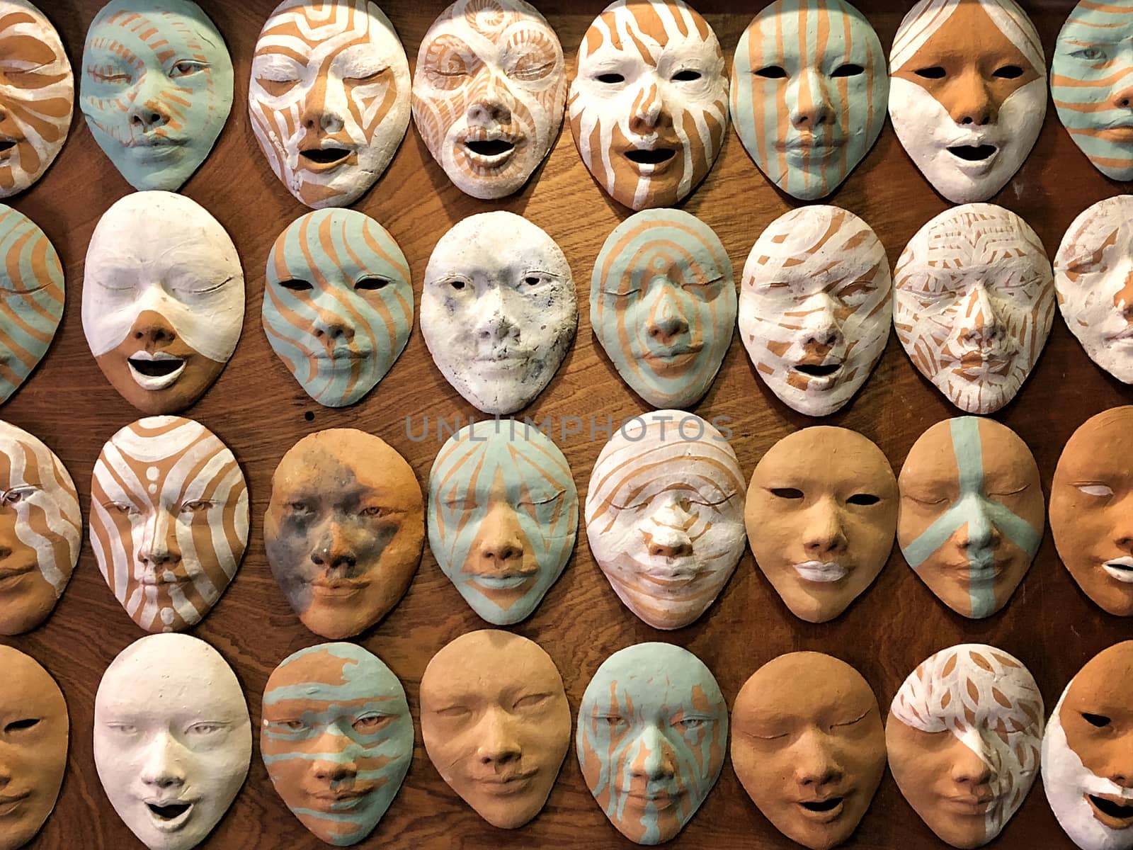 Old masks on wall with different emotional
