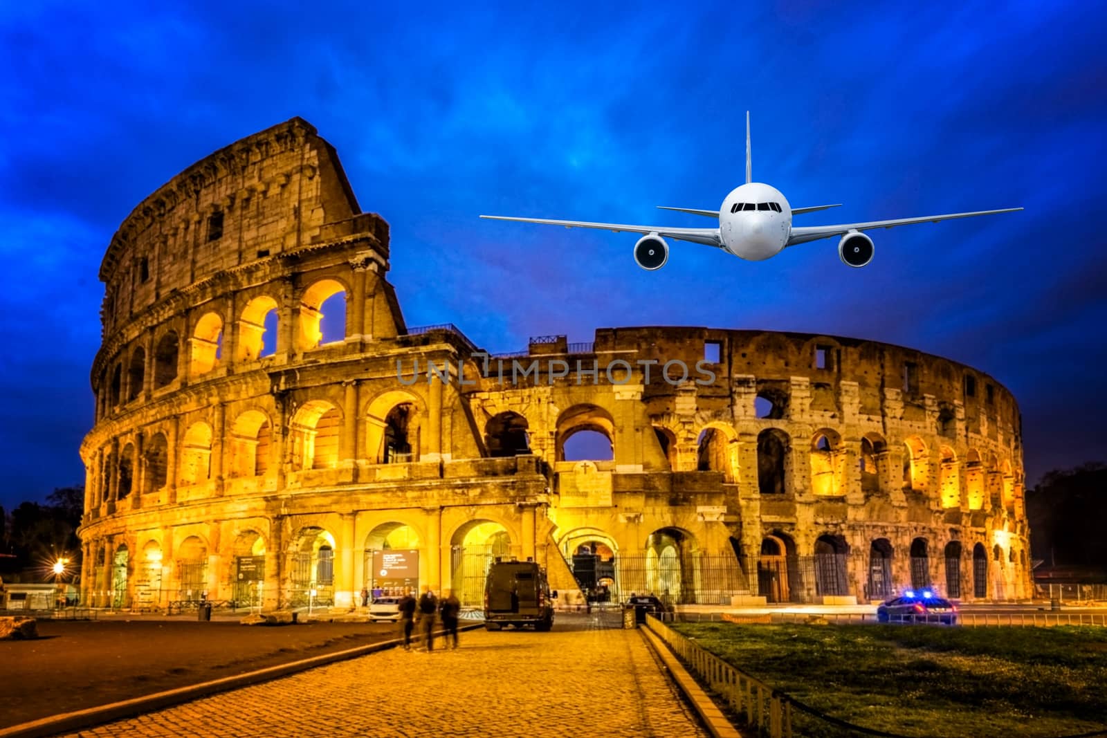 Front of real plane aircraft, on Colosseum Nigth view of Rome, Italy background