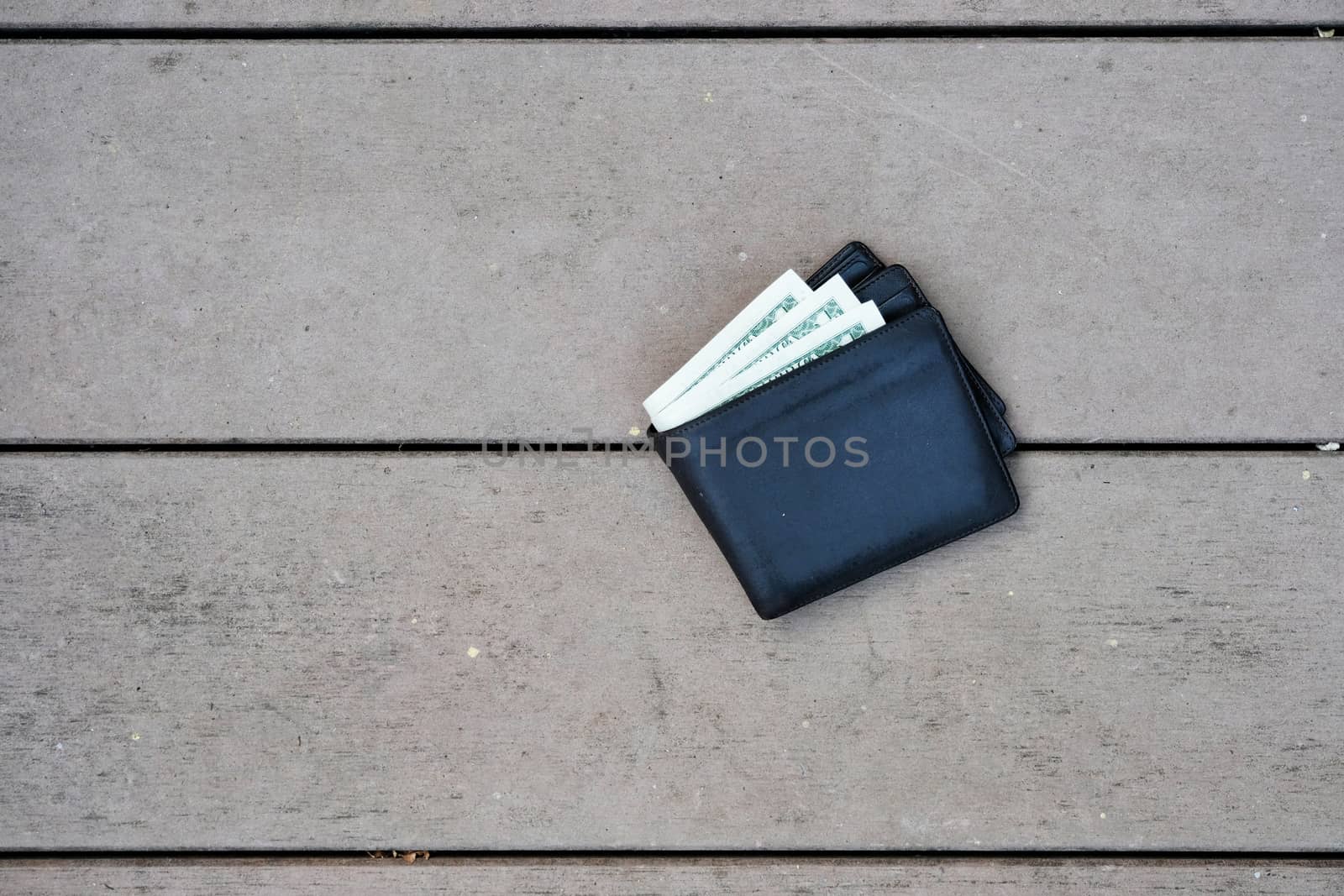 A man lost wallet on the ground by Surasak