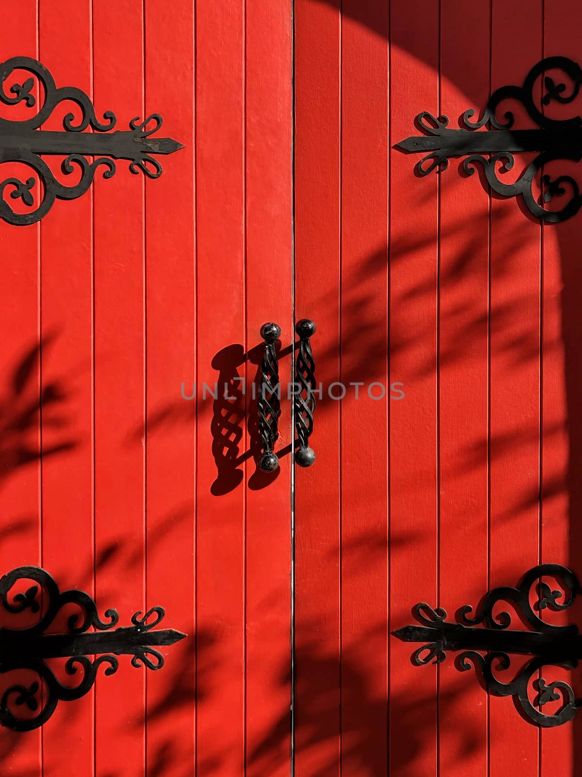 Vintage rustic exterior red door close up and detail by Surasak