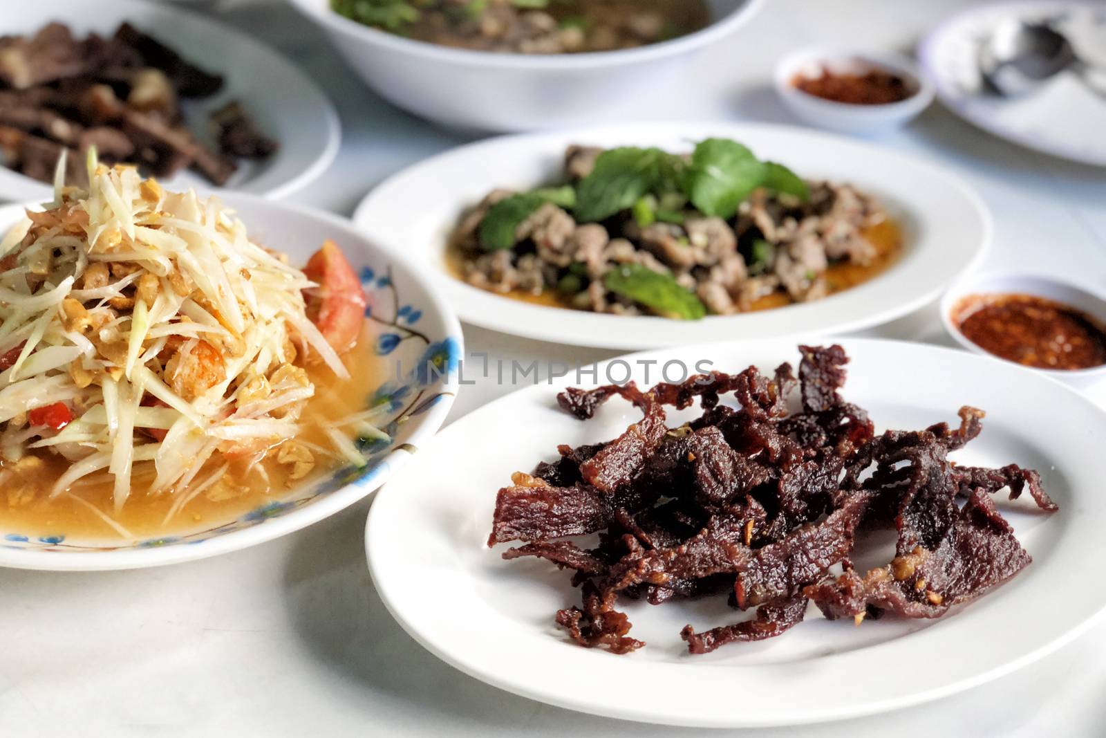 Esan Thai food Dried meat, papaya salad, Spicy minced pork by Surasak
