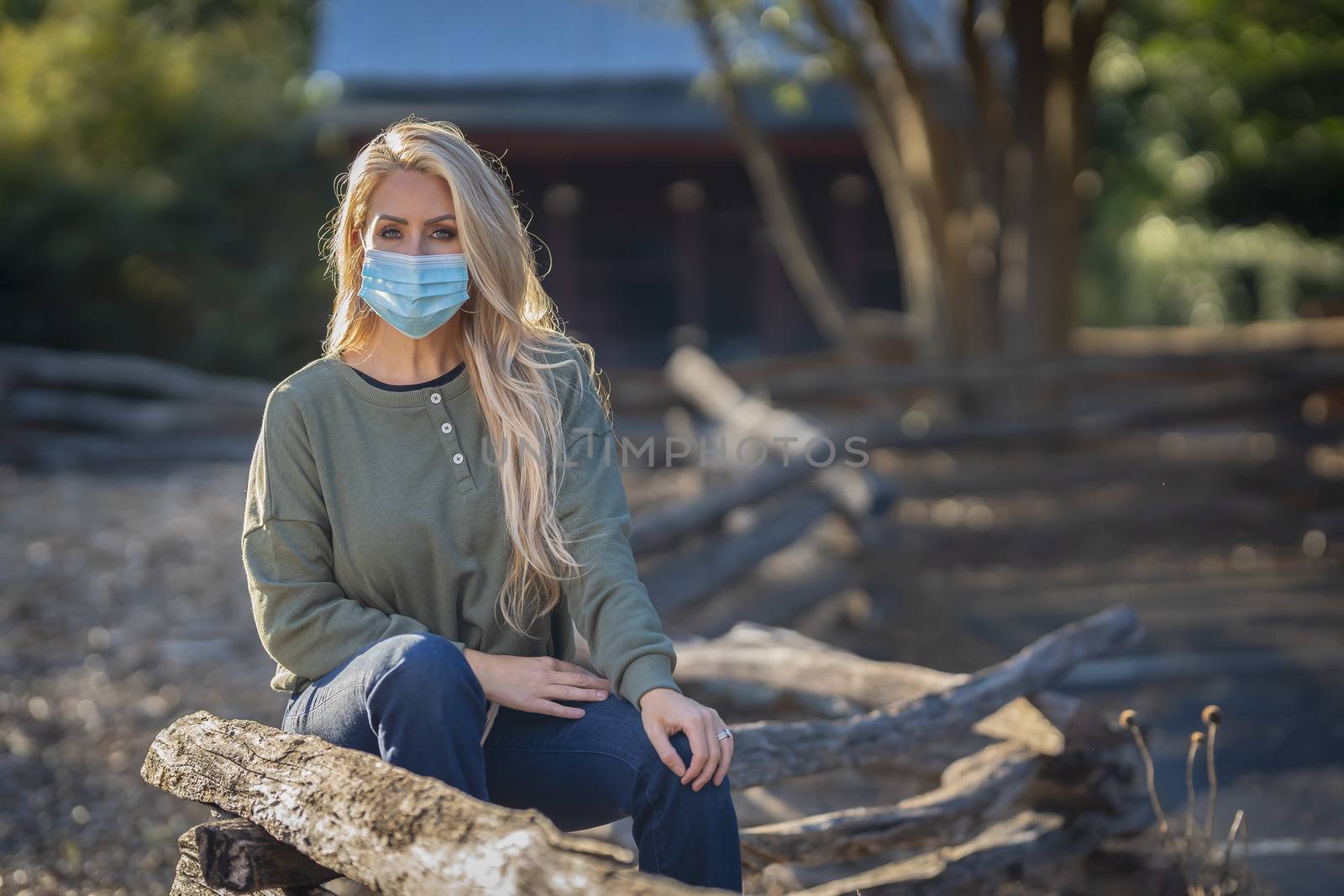 A Lovely Blonde Model Poses In Her Beautiful Fall Clothing Wearing A Personal Protective Mask by actionsports