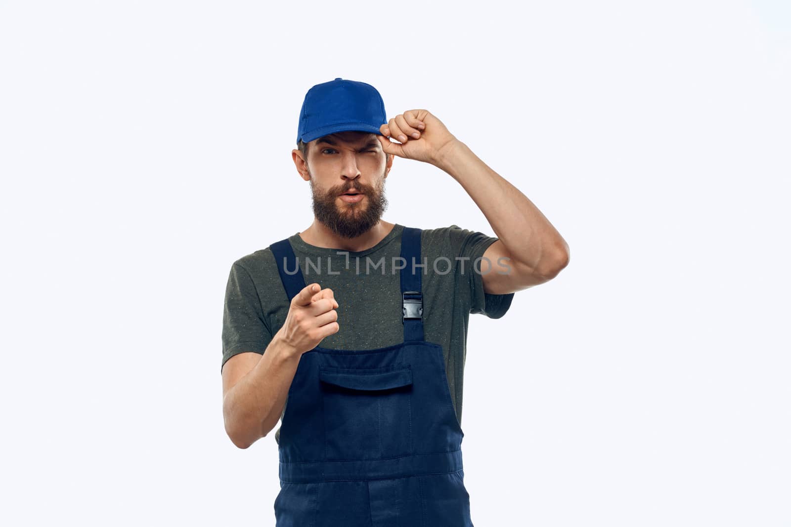 Worker man uniform delivery service emotions studio light background by SHOTPRIME