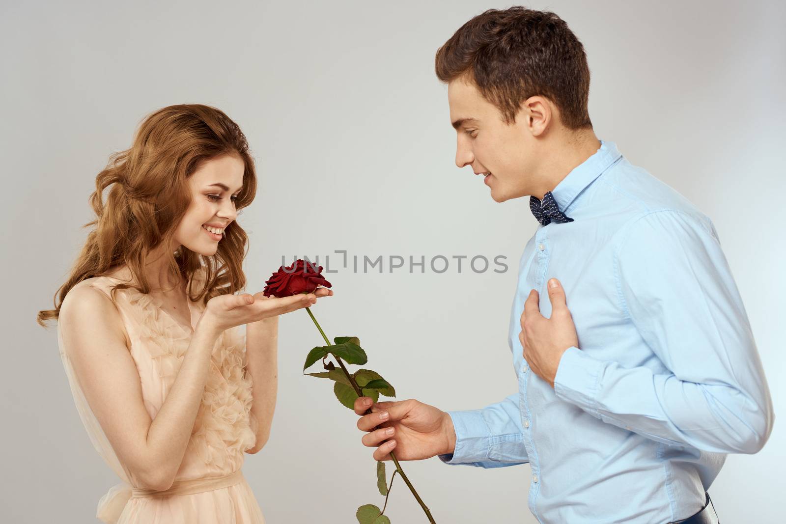Man and woman with red rose romance love family couple holiday by SHOTPRIME