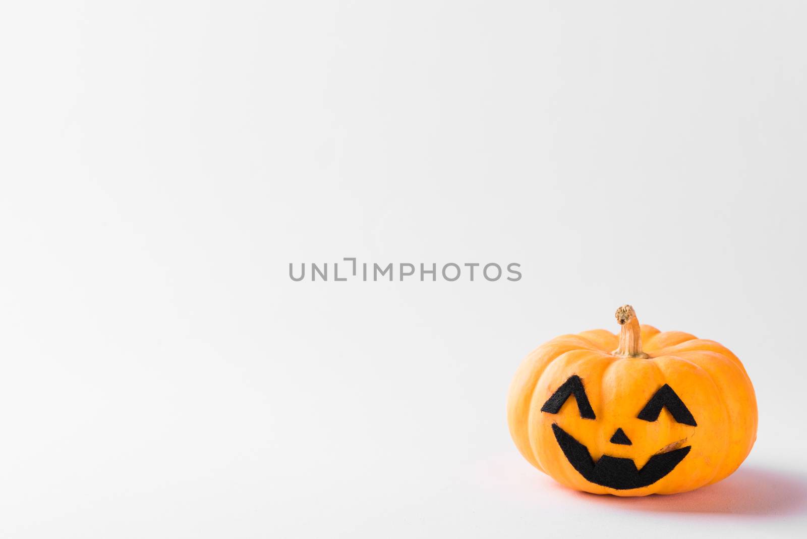 Funny Halloween day party concept ghost pumpkin head jack lantern scary smile, studio shot isolated on white background, Holiday decoration