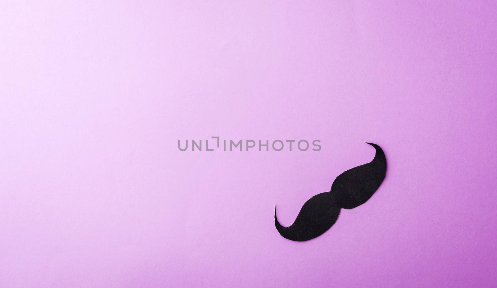 Black mustache paper on purple by Sorapop