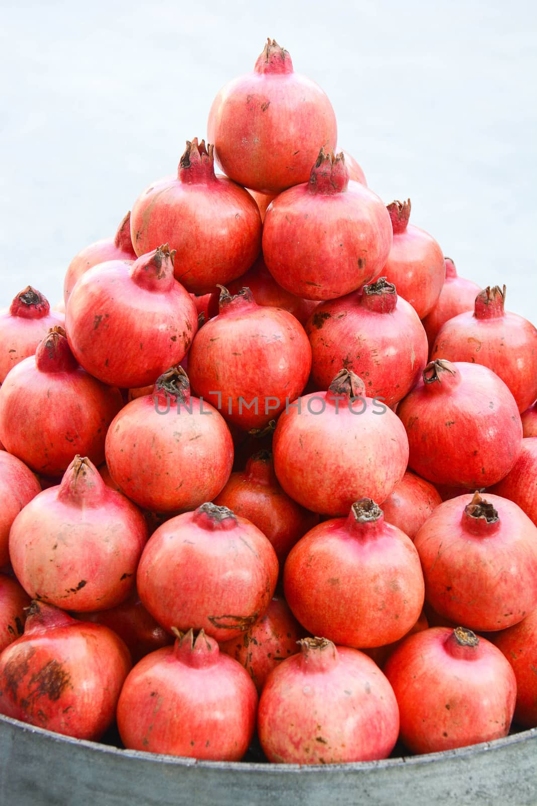 pyramid of freshly picked pomegranates