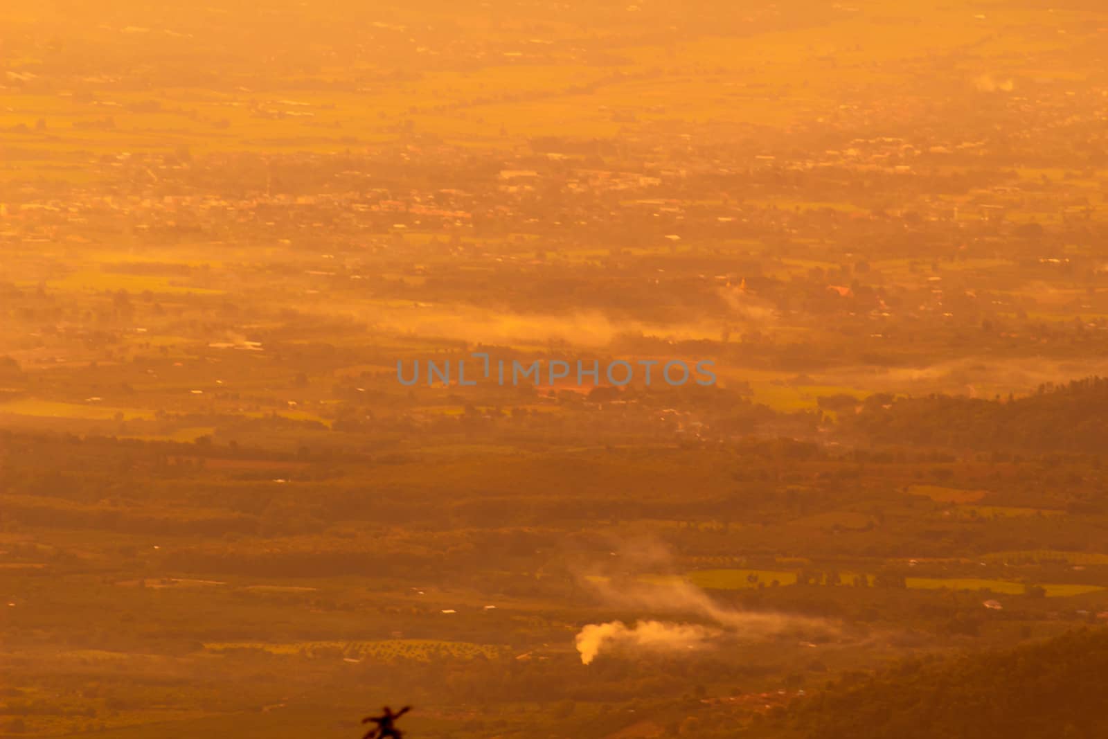 Beautiful landscape at sunset sky with clouds on peak of mountains.