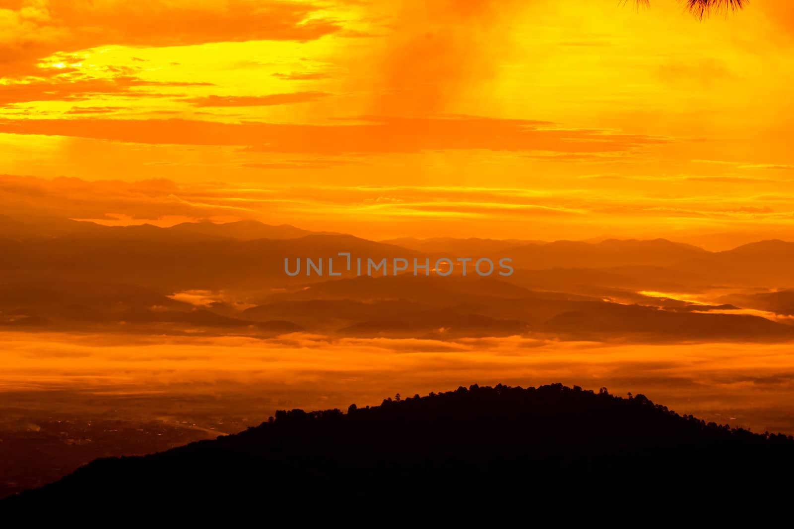 Beautiful landscape at sunset sky with clouds on peak of mountai by TEERASAK