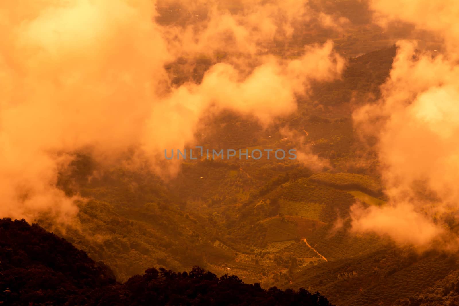 Beautiful landscape at sunset sky with clouds on peak of mountai by TEERASAK