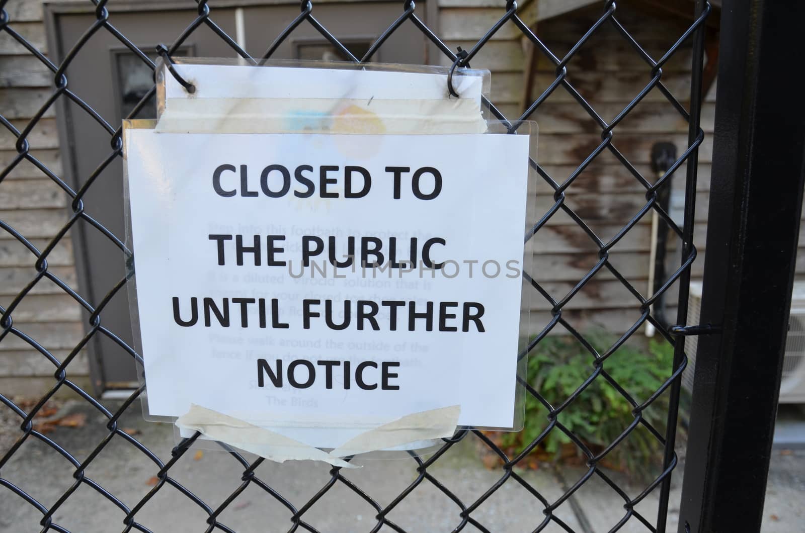 closed to the public until further notice sign on metal fence