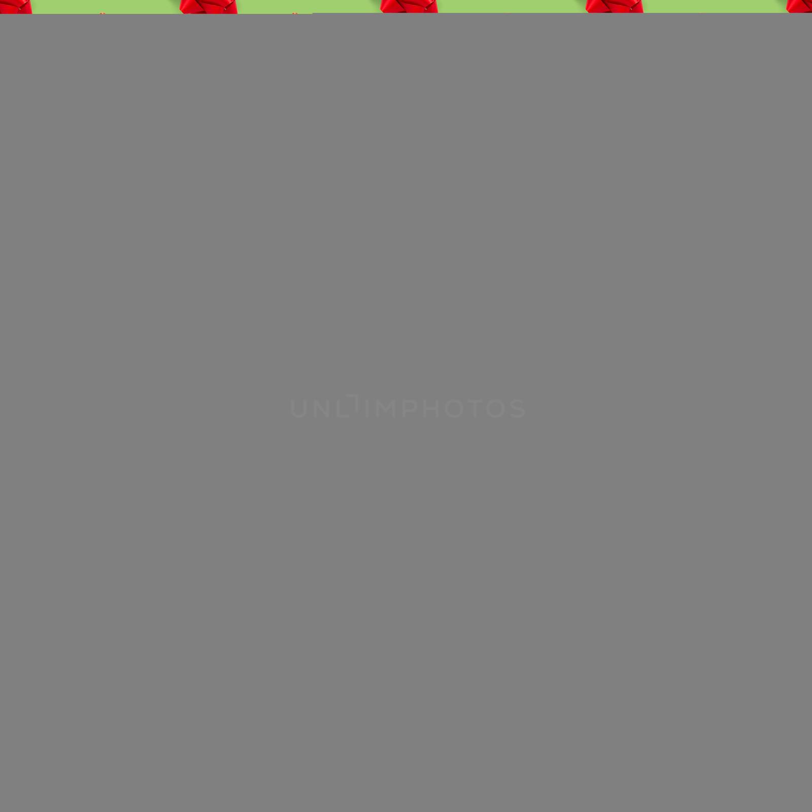 Seamless regular creative Christmas pattern with New Year decorations on green background. xmas Modern Seamless pattern made from christmas decorations. Photo quality pattern for fabric, prints, wallpapers, banners or creative design works.