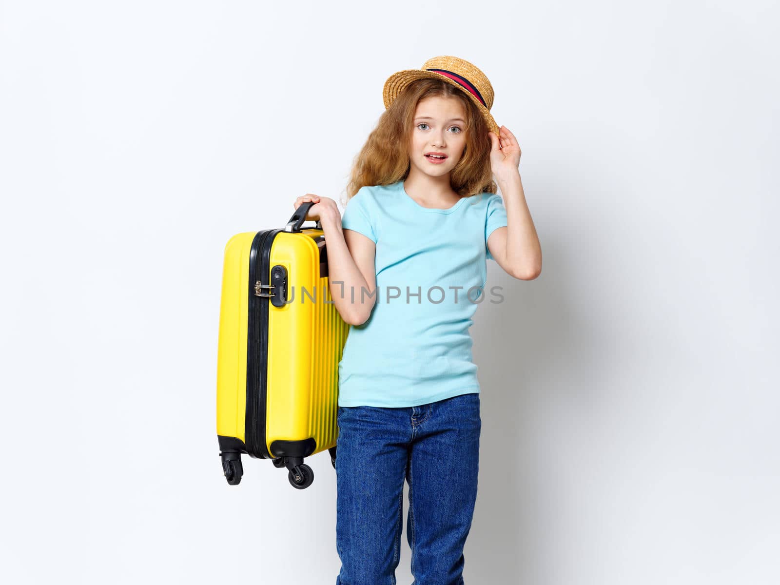 Girl Tourist yellow suitcase vacation travel hat on head