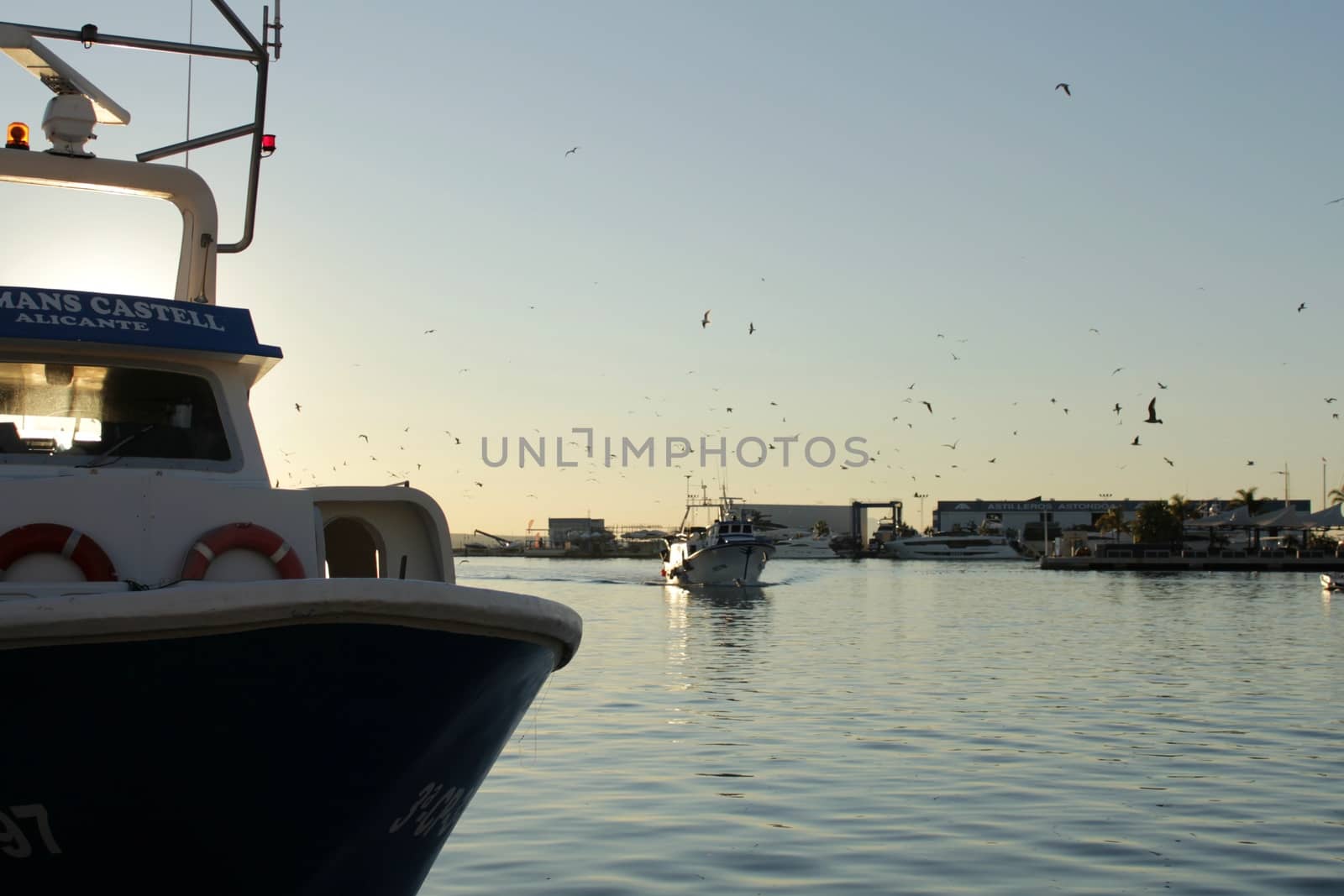 Fishing boat entering port in southern Spain by soniabonet