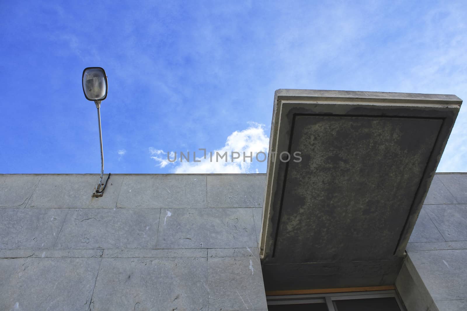 Concrete facade and lamppost by soniabonet