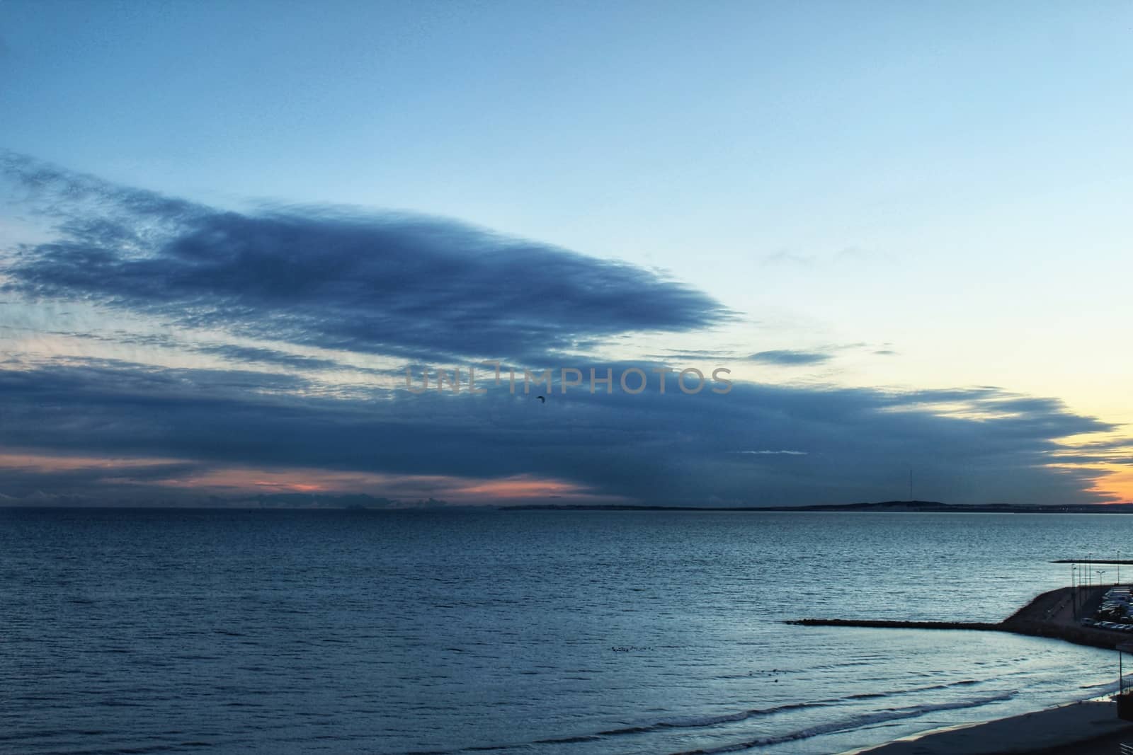 Spectacular and colorful sunset in the bay of Santa Pola, Alicante, Spain in autumn