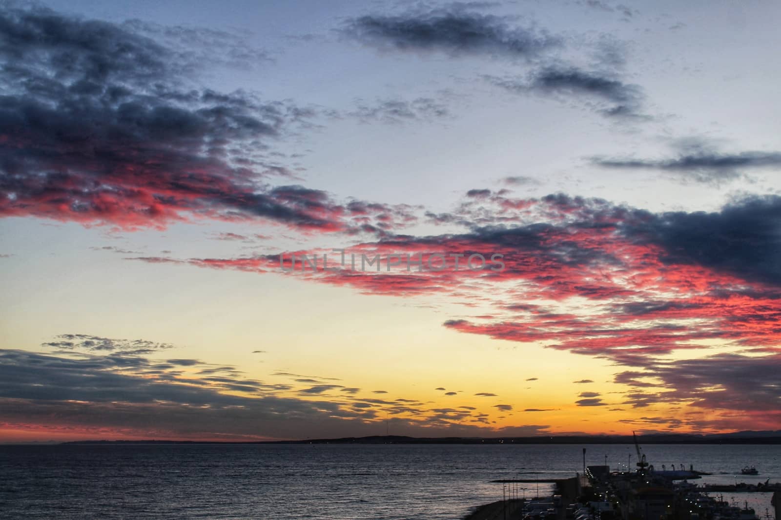 Spectacular and colorful sunset in the bay of Santa Pola, Alicante, Spain in autumn