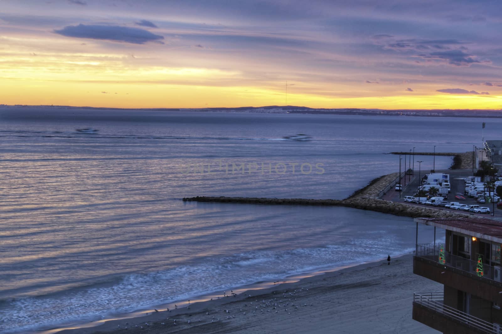 Spectacular and colorful sunset in the bay of Santa Pola, Alicante, Spain in autumn