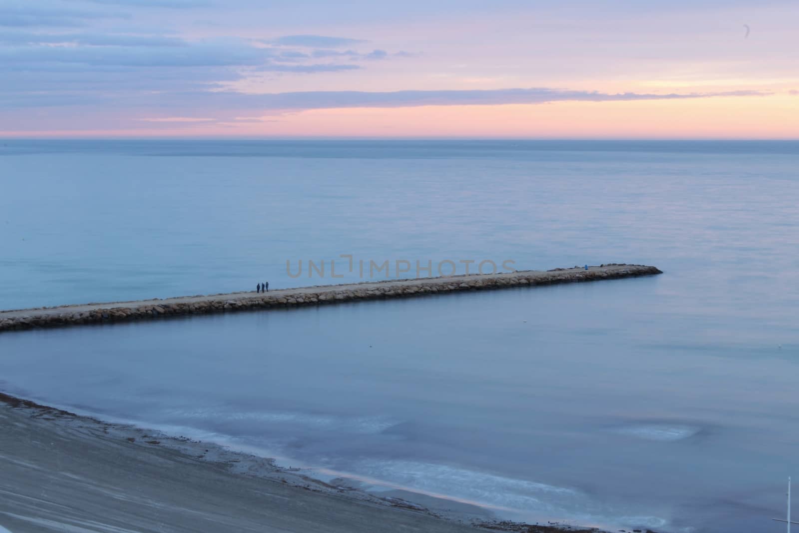 Spectacular and colorful sunset in the bay of Santa Pola, Alicante, Spain in autumn