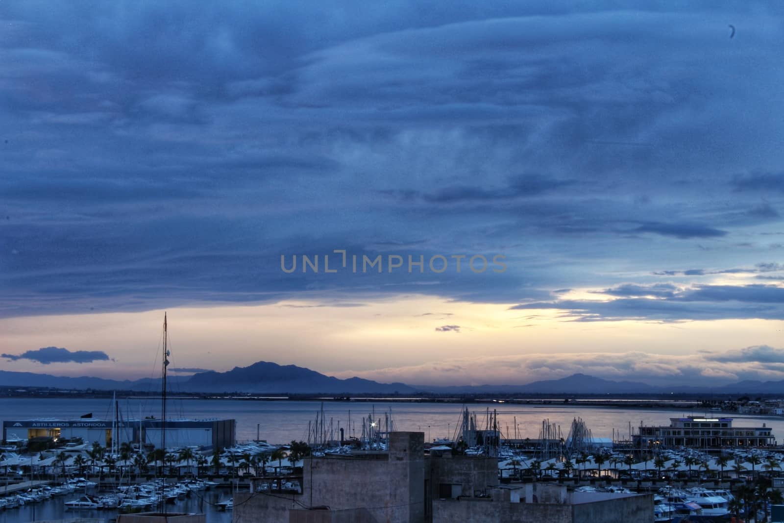 Spectacular and colorful sunset in the bay of Santa Pola, Alicante, Spain in autumn