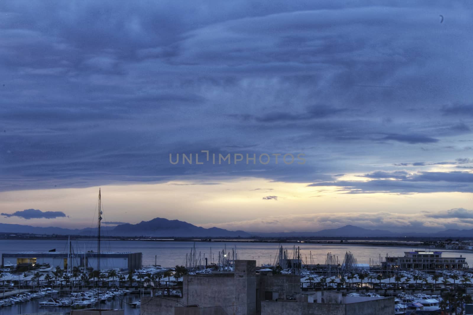 Spectacular and colorful sunset in the bay of Santa Pola, Alicante, Spain in autumn