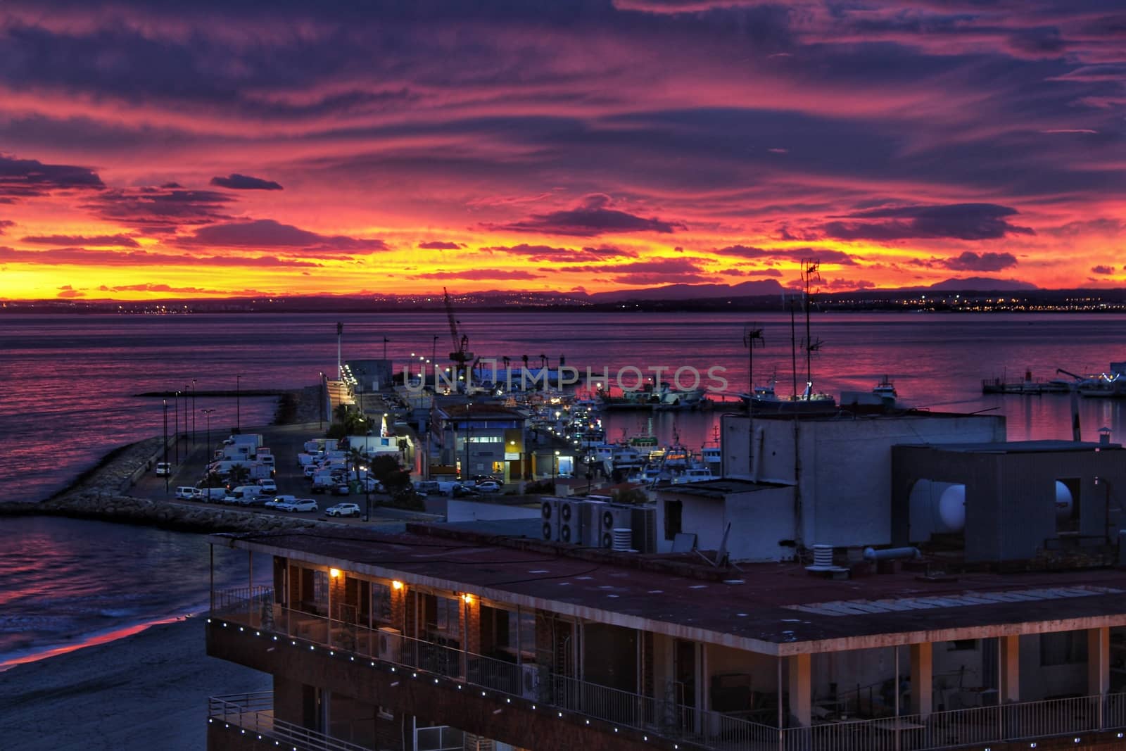 Spectacular and colorful sunset in the bay of Santa Pola, Alicante, Spain in autumn