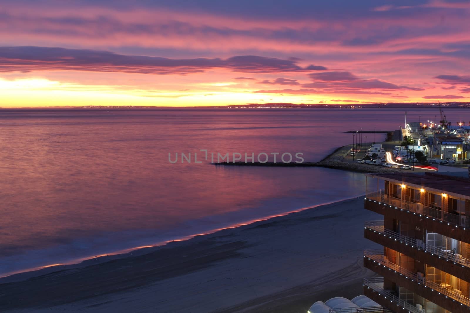 Spectacular and colorful sunset in the bay of Santa Pola, Alicante, Spain in autumn