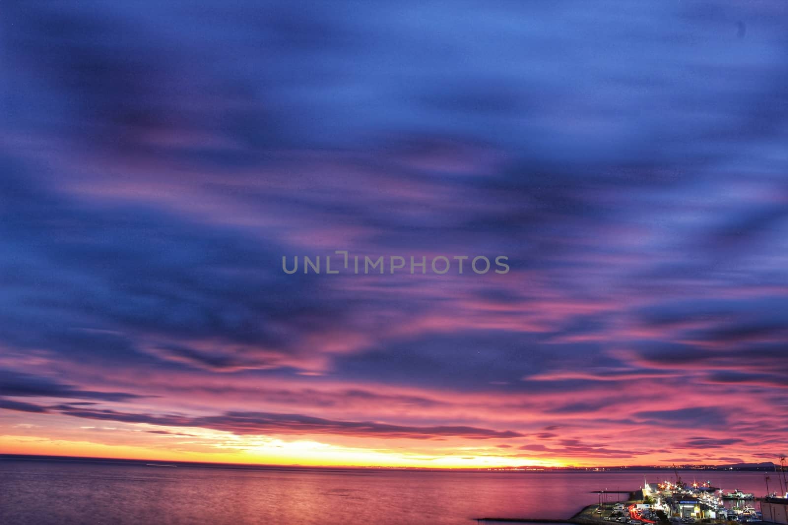 Spectacular and colorful sunset in the bay of Santa Pola, Alicante, Spain in autumn