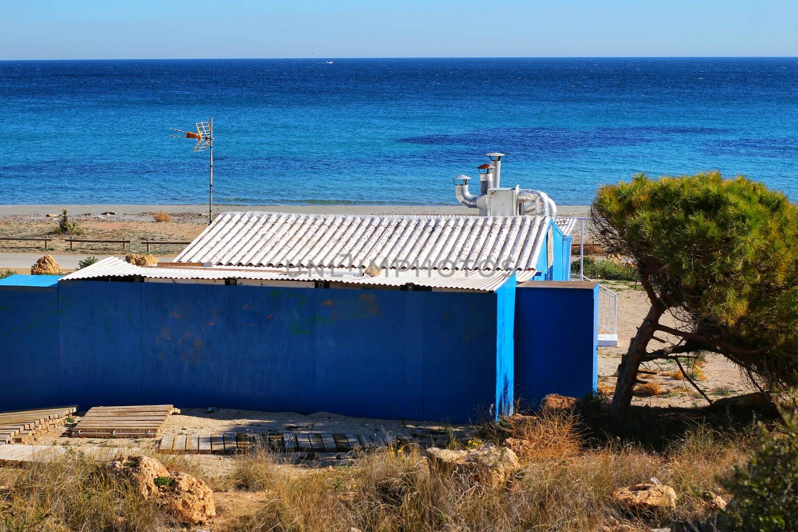 Old blue cabin on the beach in Santa Pola, Alicante