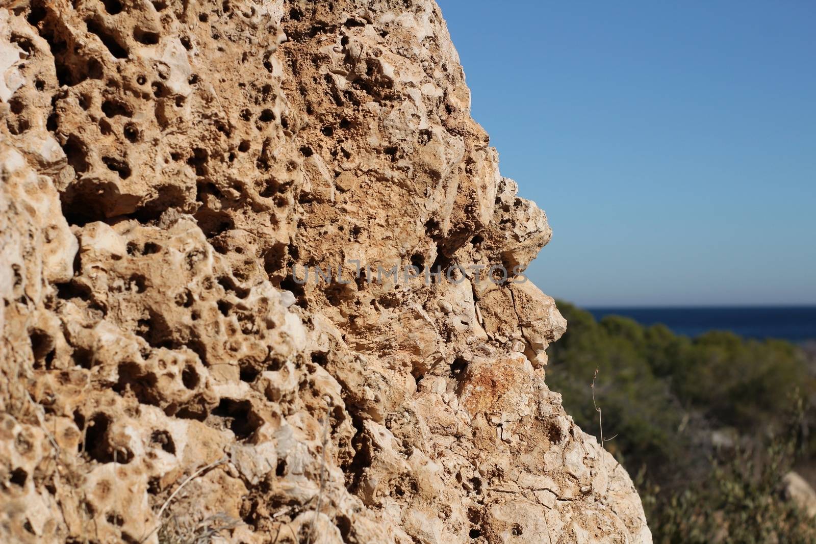 Colorful rock texture on the beach in Santa Pola, Alicante