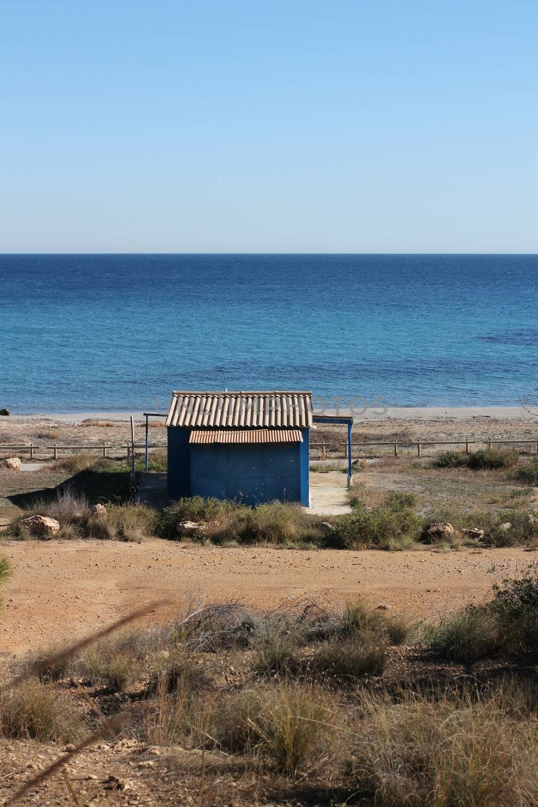 Old blue cabin on the beach in Santa Pola by soniabonet