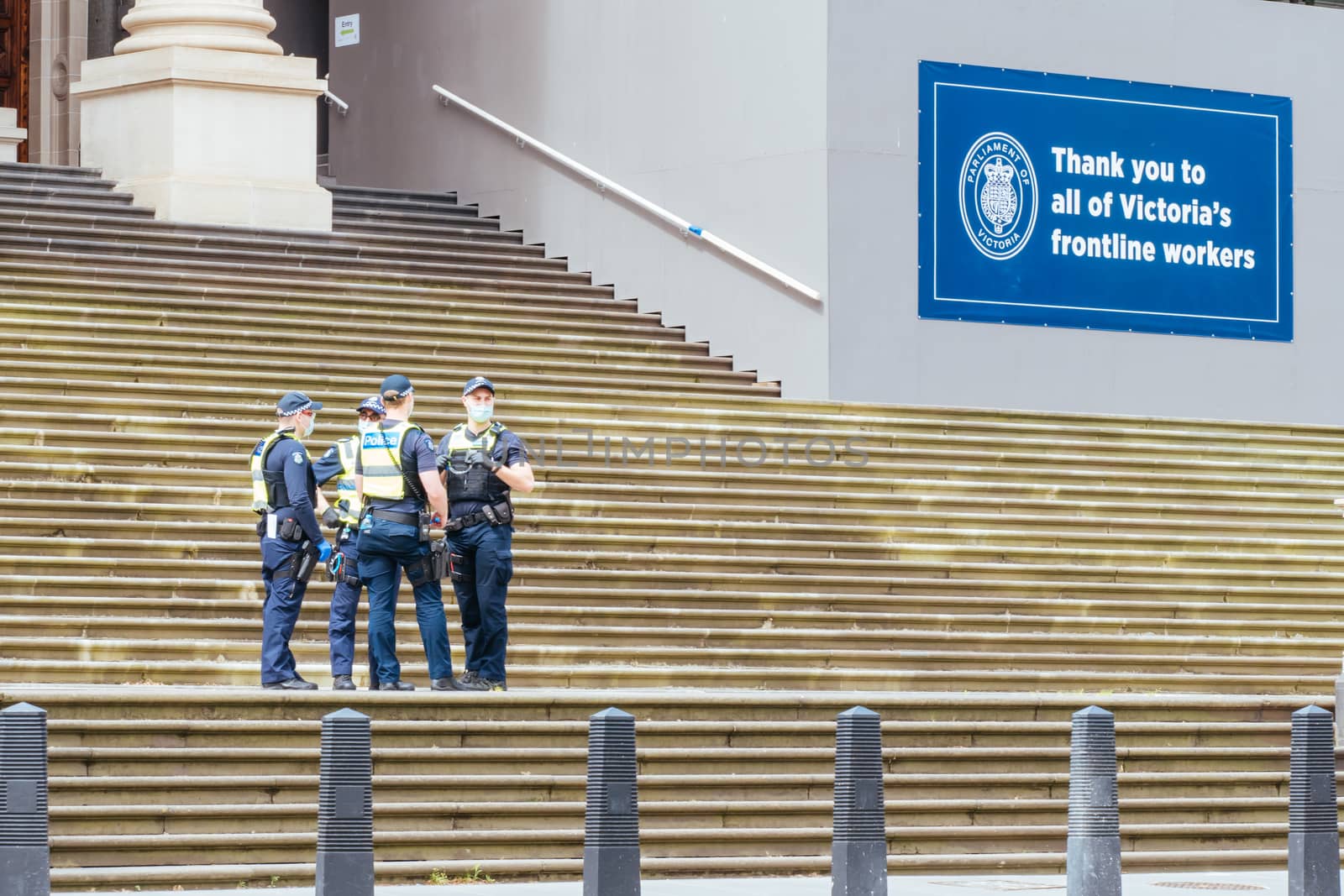 Melbourne, Australia - October 18, 2020: Victoria police patrol Melbourne CBD streets and Parliament, checking on people during the Coronavirus pandemic and associated lockdown.