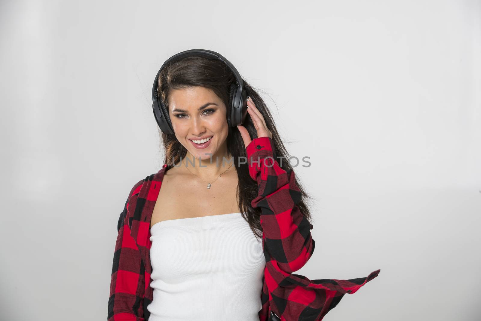A gorgeous brunette model posing in a studio environment