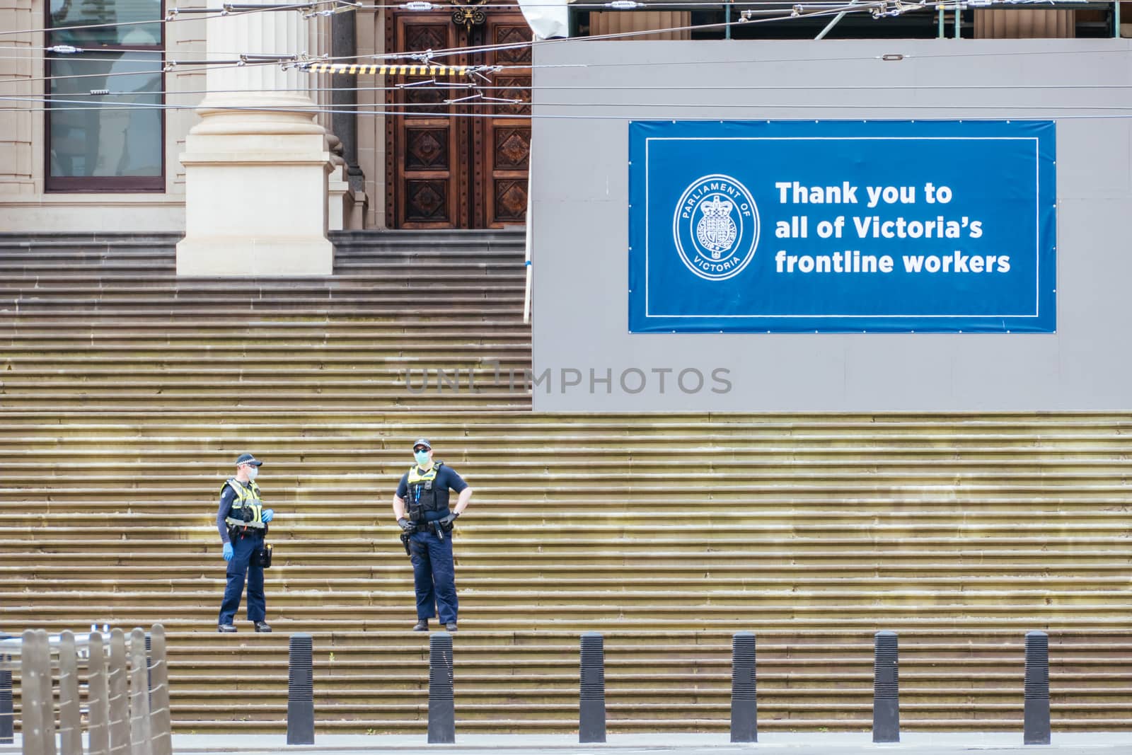Melbourne, Australia - October 18, 2020: Victoria police patrol Melbourne CBD streets and Parliament, checking on people during the Coronavirus pandemic and associated lockdown.