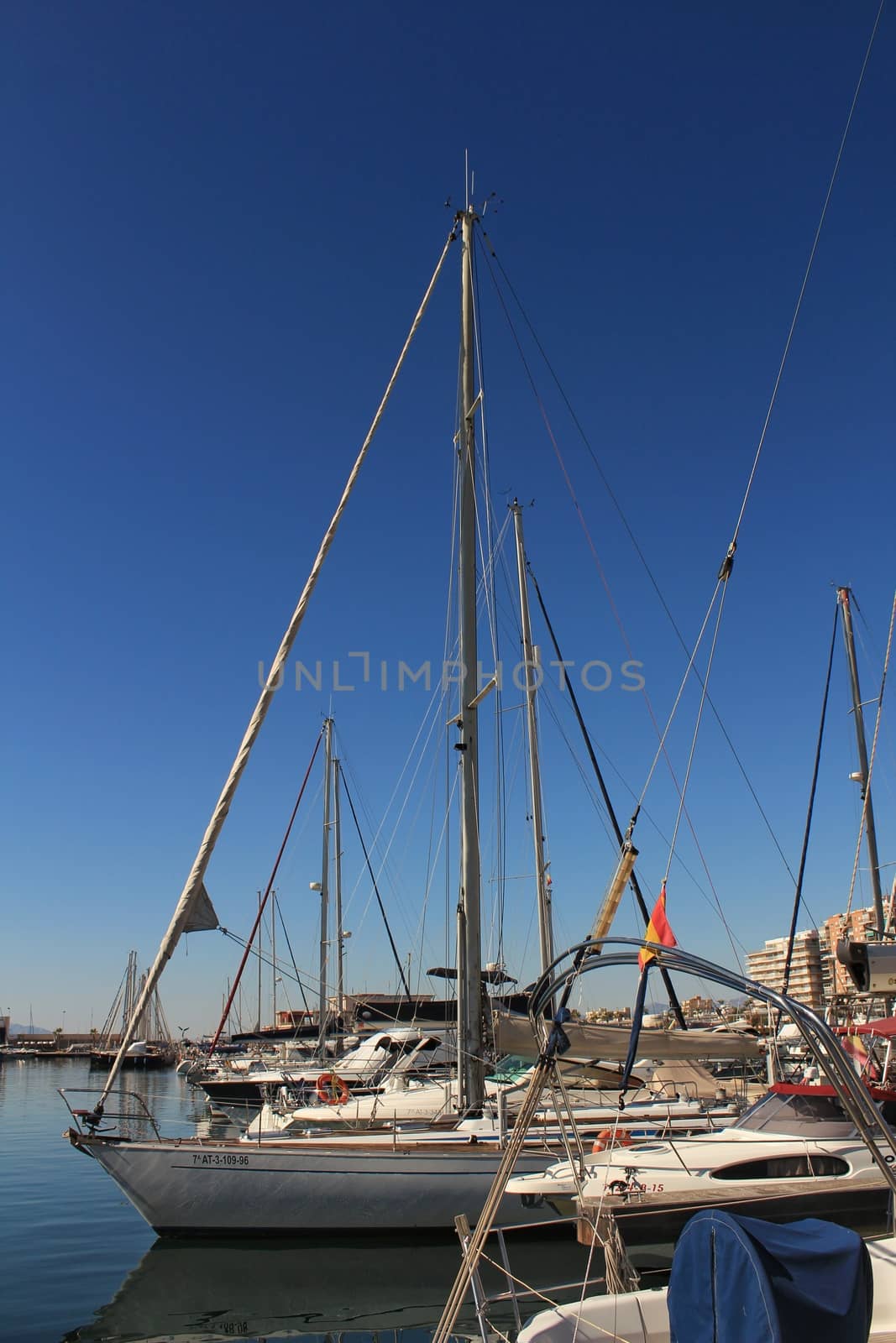 Santa Pola, Spain- 15 February, 2018: Recreational boats moored at the dock in the nautical club of Santa Pola in a sunny day