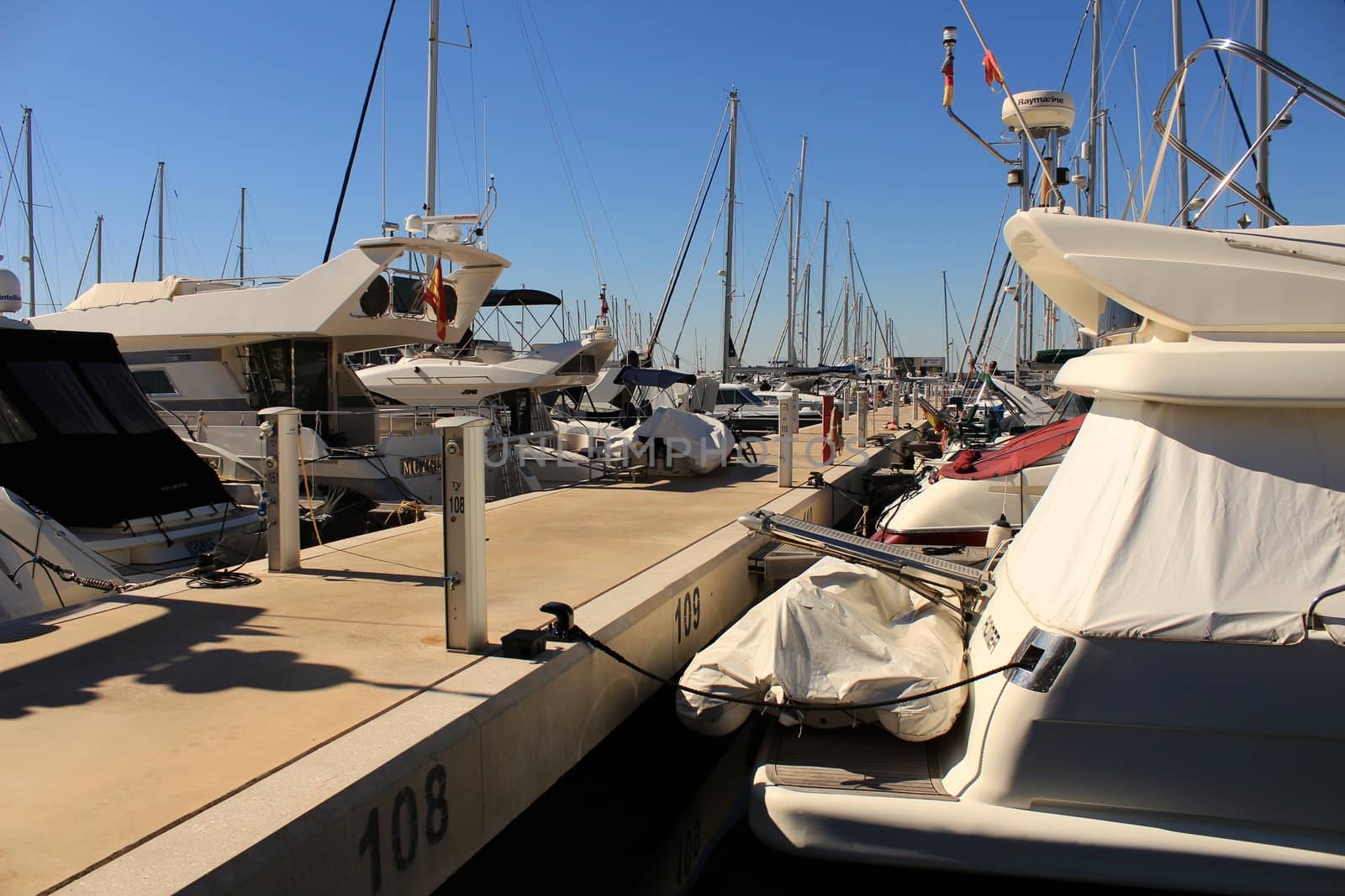 Santa Pola, Spain- 15 February, 2018: Recreational boats moored at the dock in the nautical club of Santa Pola in a sunny day