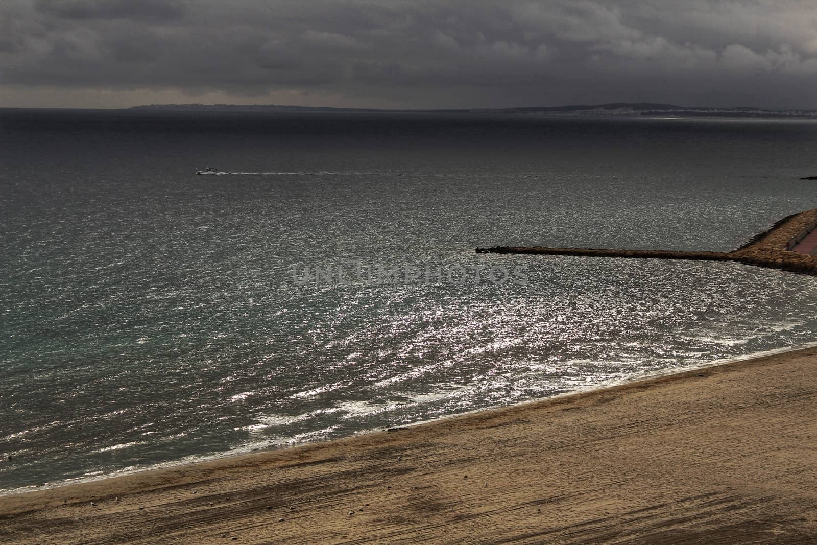 Beach under stormy sky in Santa Pola, Alicante, Spain