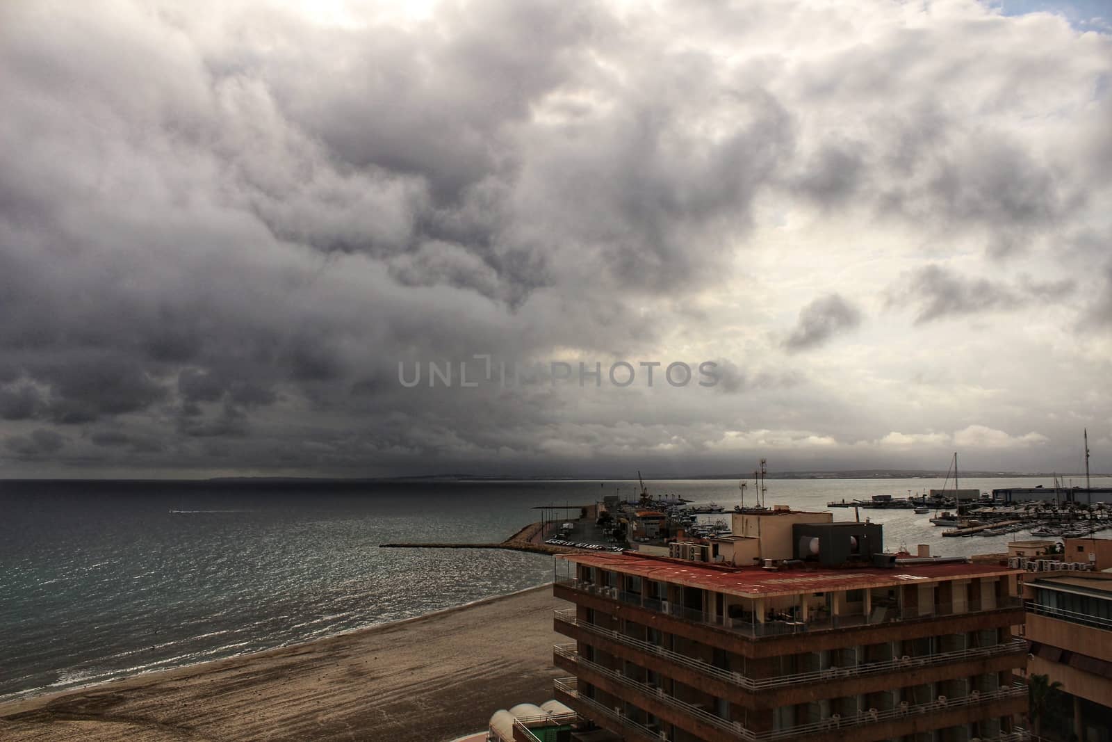 Beach under stormy sky in Santa Pola, Alicante, Spain