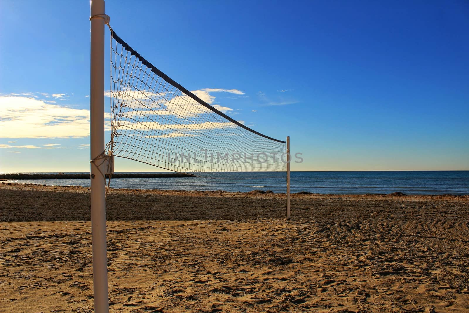 Volleyball net on the beach in the morning