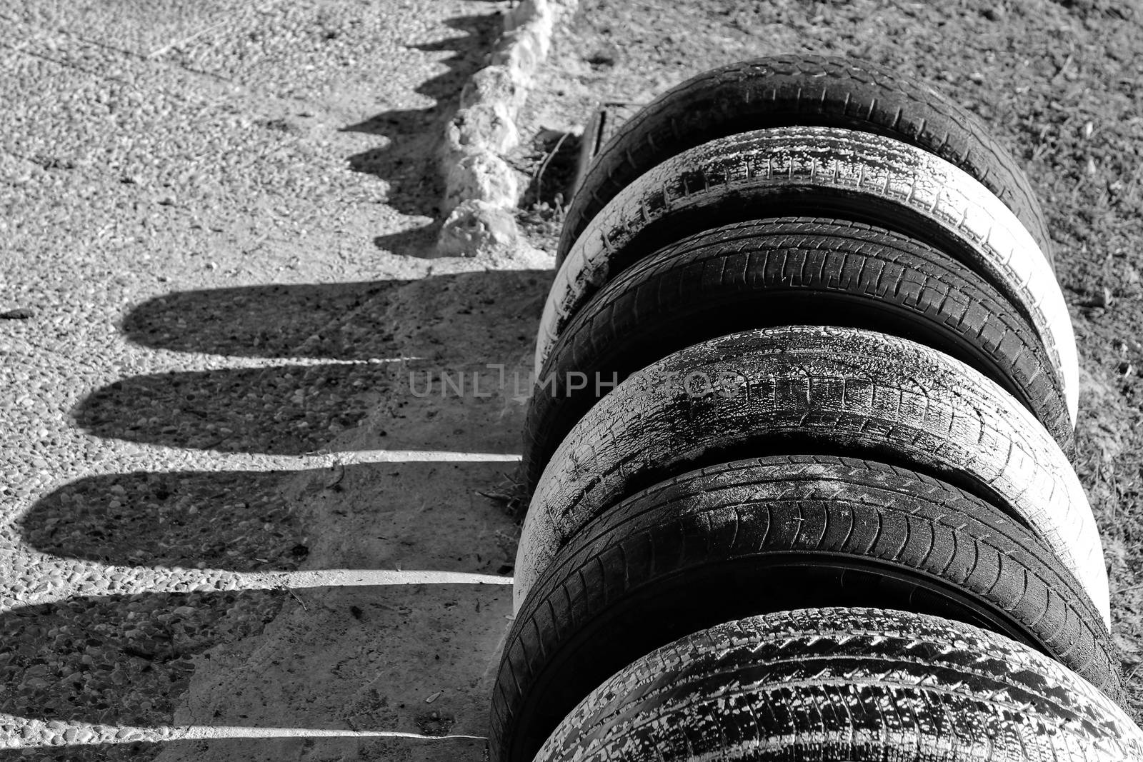 Ecological bicycle parking made with tires on the beach in Santa Pola, Spain