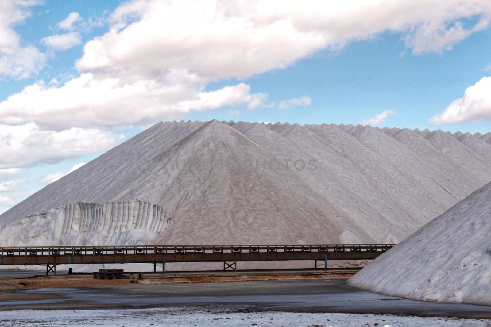 Salt mountains under blue sky in Santa Pola, Spain