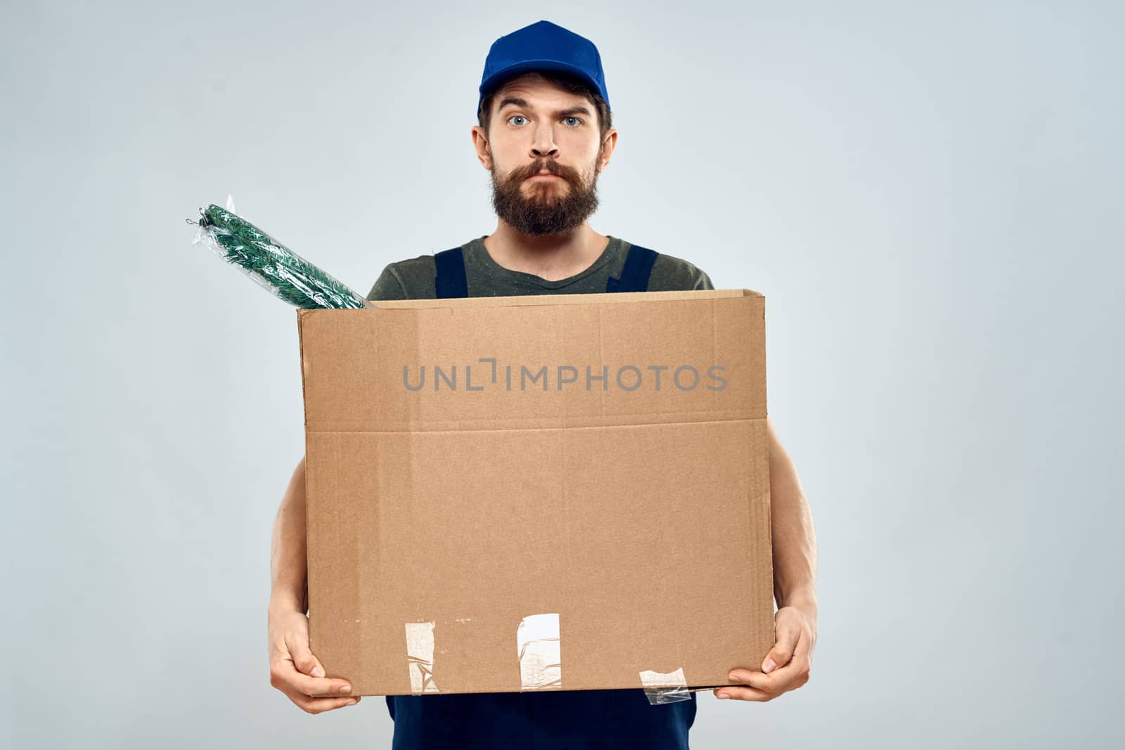 Worker man with box delivery packing work service by SHOTPRIME
