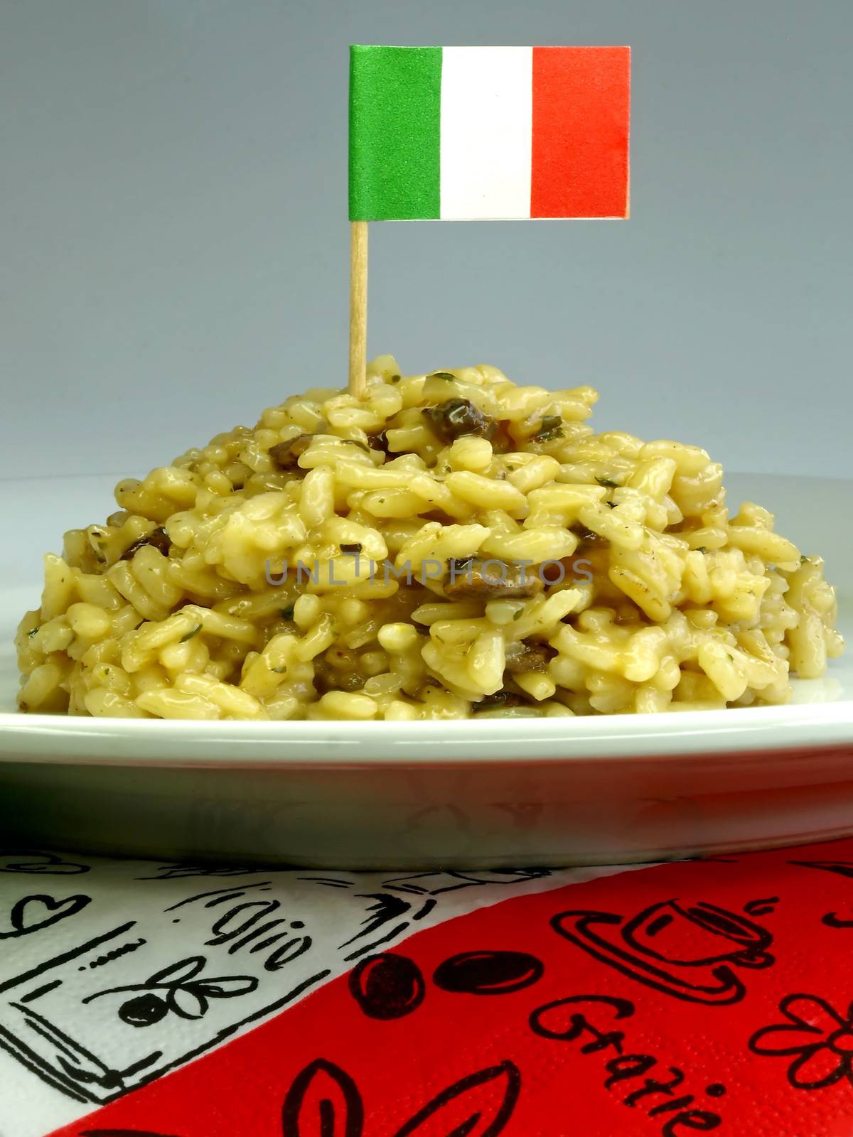 risotto with mushroom and a flag of Italy